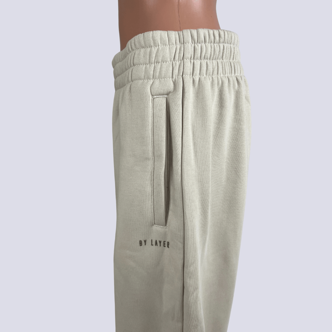 Side detail view of theBy Layer Sweat Pants