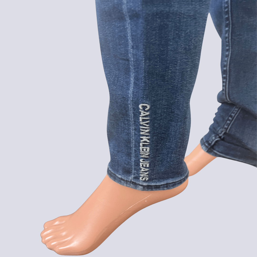 Cuff detail view of the Calvin Klein Mid Rise Skinny Ankle Jeans