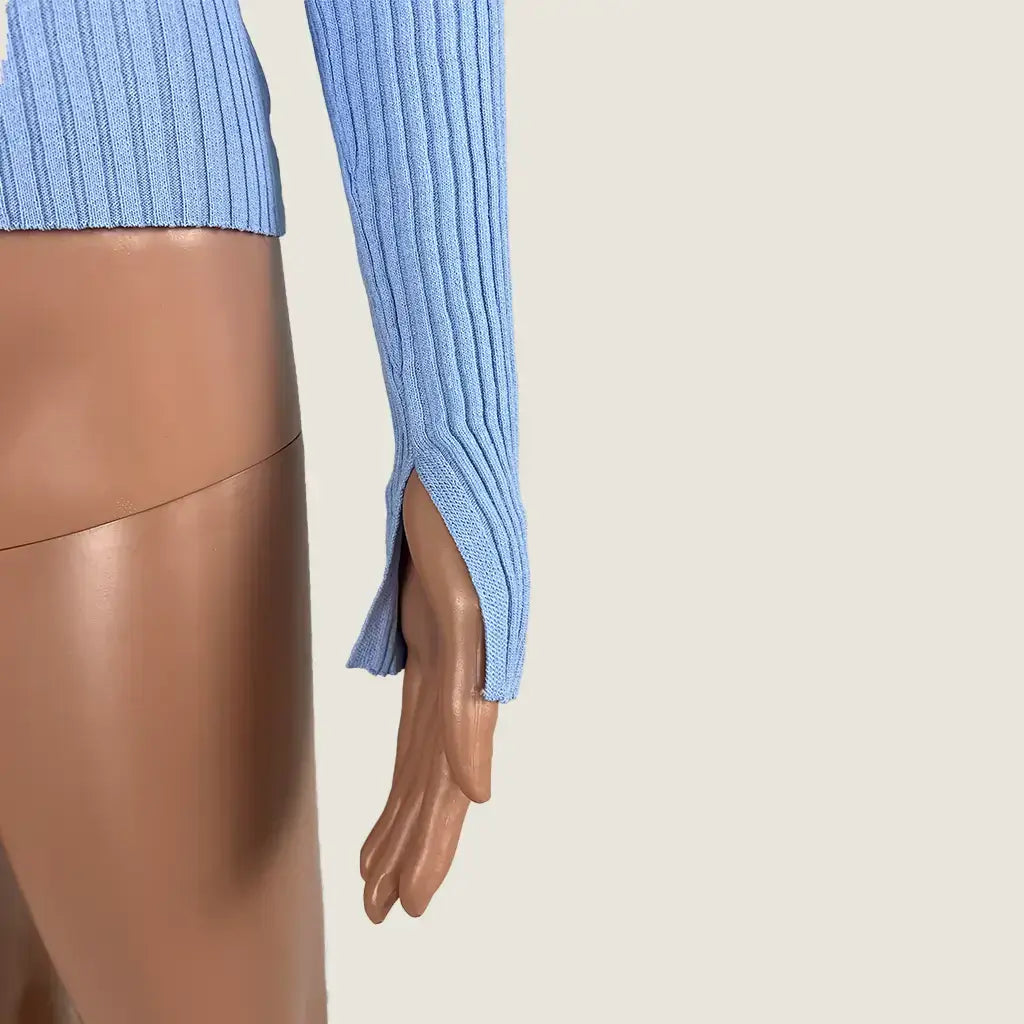 Side Detail View of the Atmos & Here Sophia Polo Knit Top