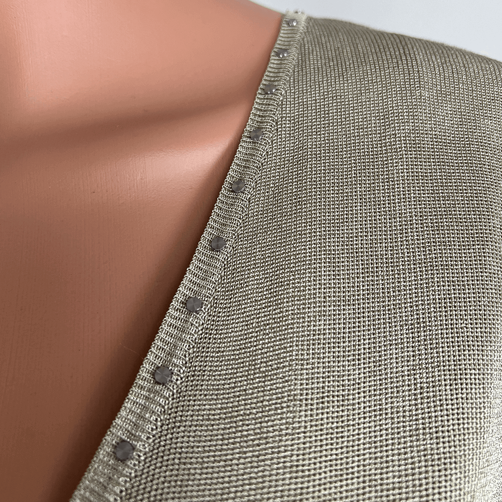 Front close up of Cami V neck collar with stud feature trim