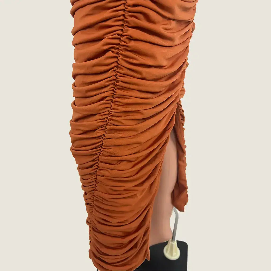 Side hem view of the By Johnny Gloria Gathered Strapless Midi Dress