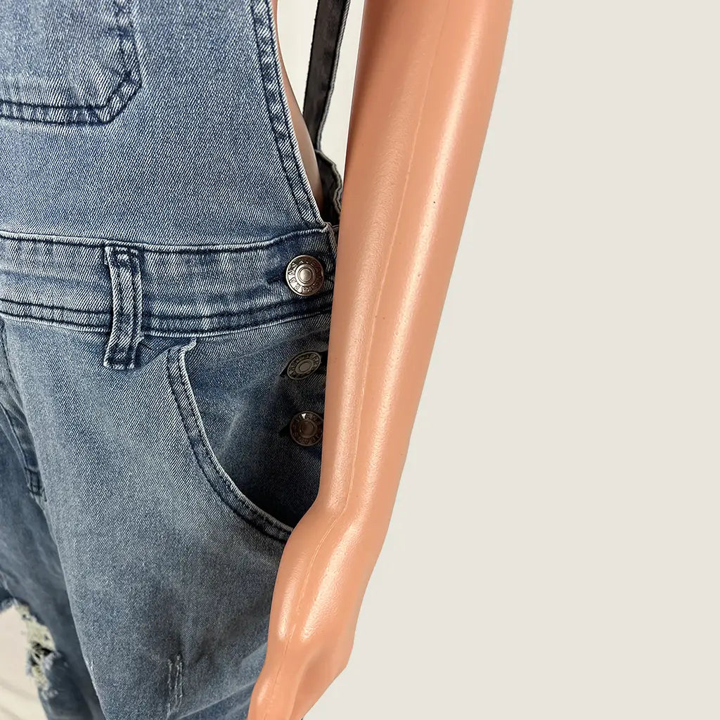Side Detail View of the Women's Distressed Denim Overalls