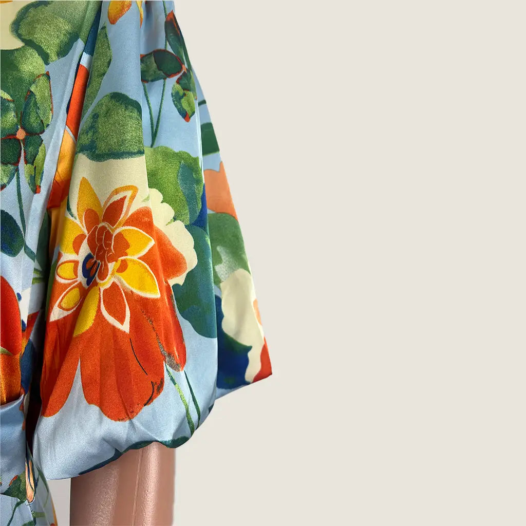 Side Sleeve View of the Divine Avenue Midi Floral Dress Front Cut Out
