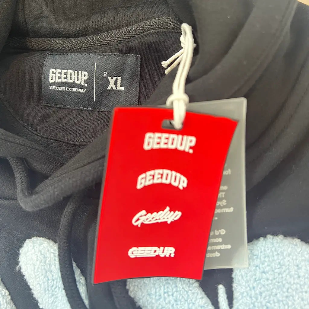 Tag Detail of the Geedup Co Handstyle Hoodie | Black/Baby Blue