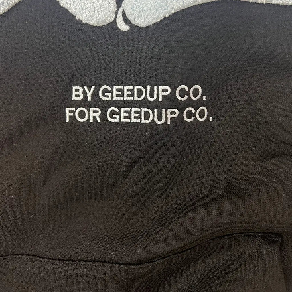 Logo Detail of the Geedup Co Handstyle Hoodie | Black/Baby Blue
