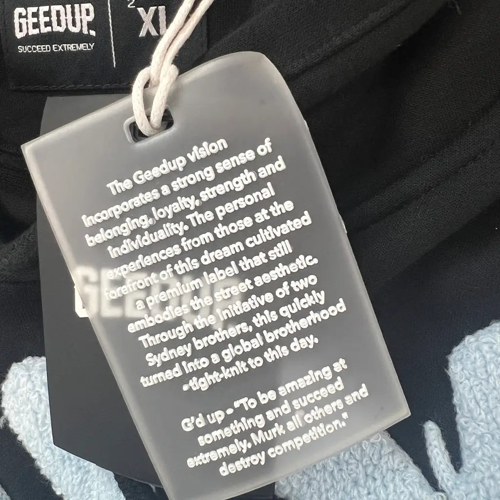 Tag Detail of the Geedup Co Handstyle Hoodie | Black/Baby Blue