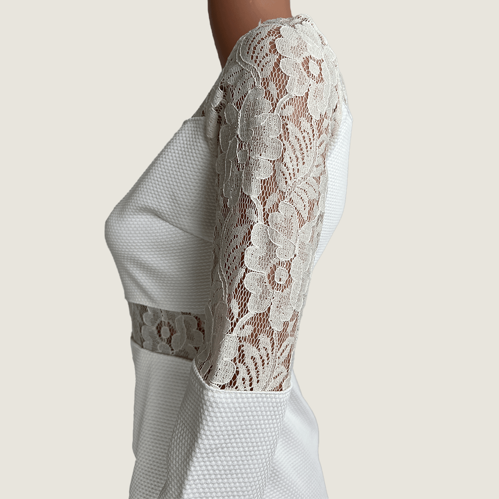 Close up side view of Levantine White Cut Out Midi Dress