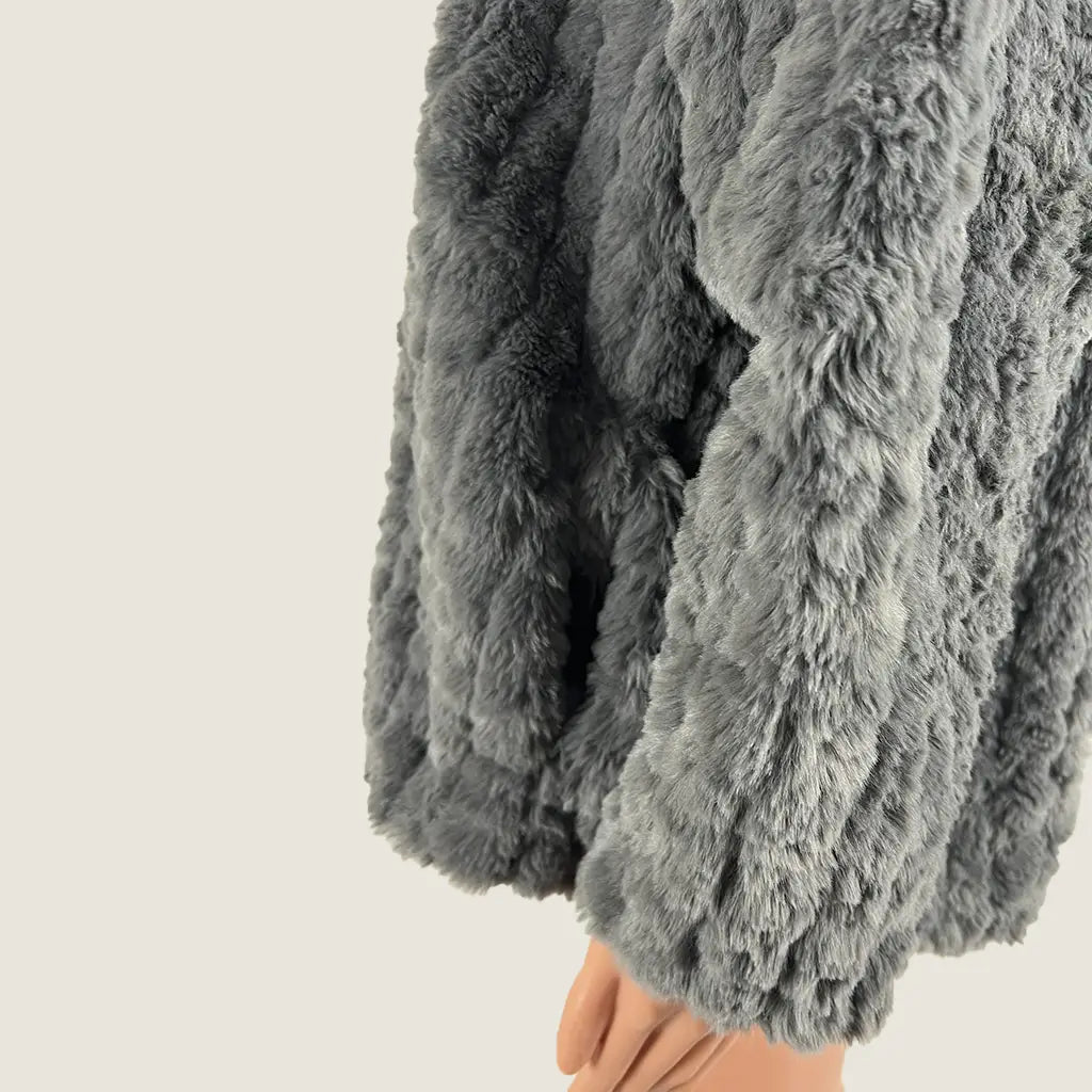 Side Detail View of the Liz Jordon Faux Fur Short Coat