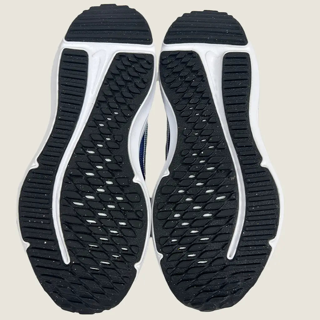 Sole View of the Nike Downshifter 12 Next Nature GS Kids Running Shoes