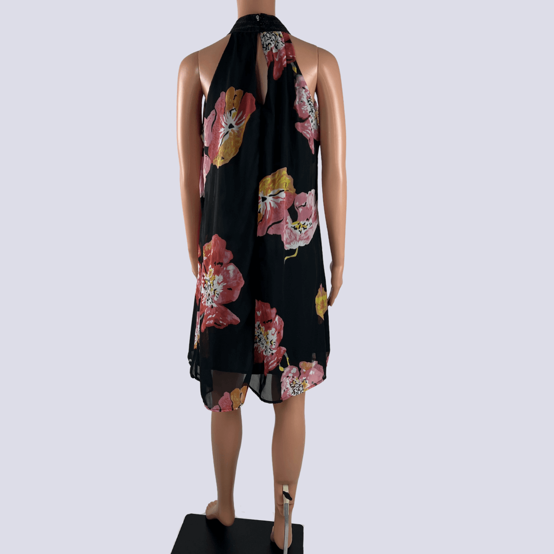 Back view of the Now baby doll midi dress