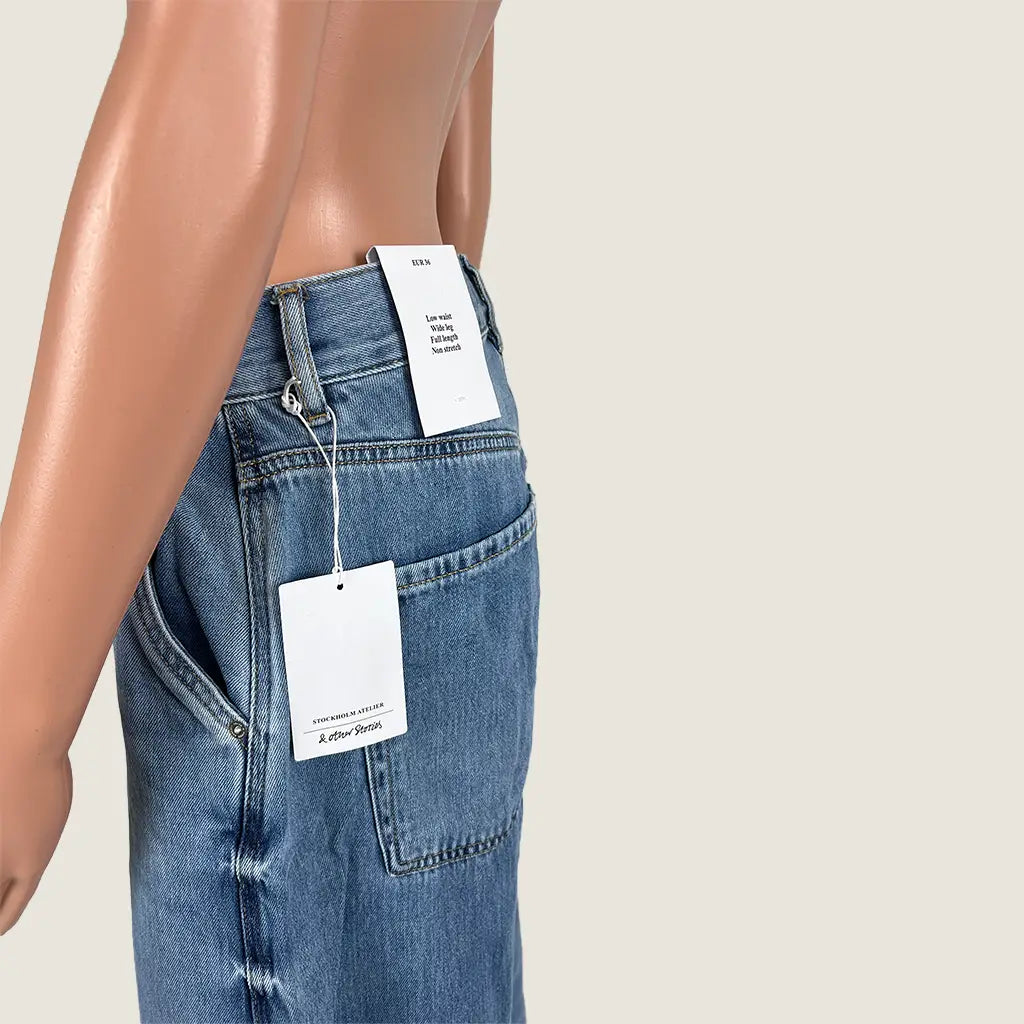Side Detail View of the & Other Stories Low Rise Wide Leg Jean