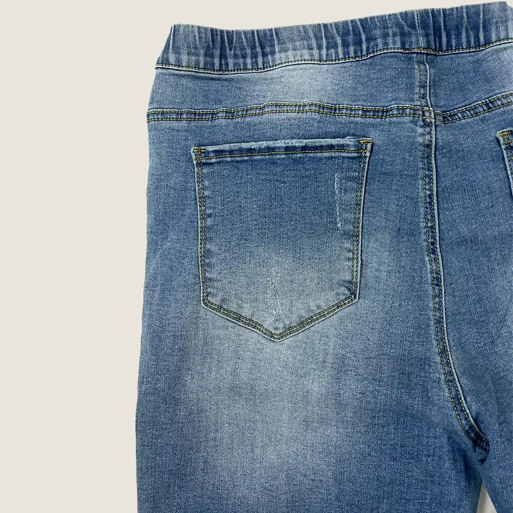 Back Waist View of the Threads Distressed Pull On Jean