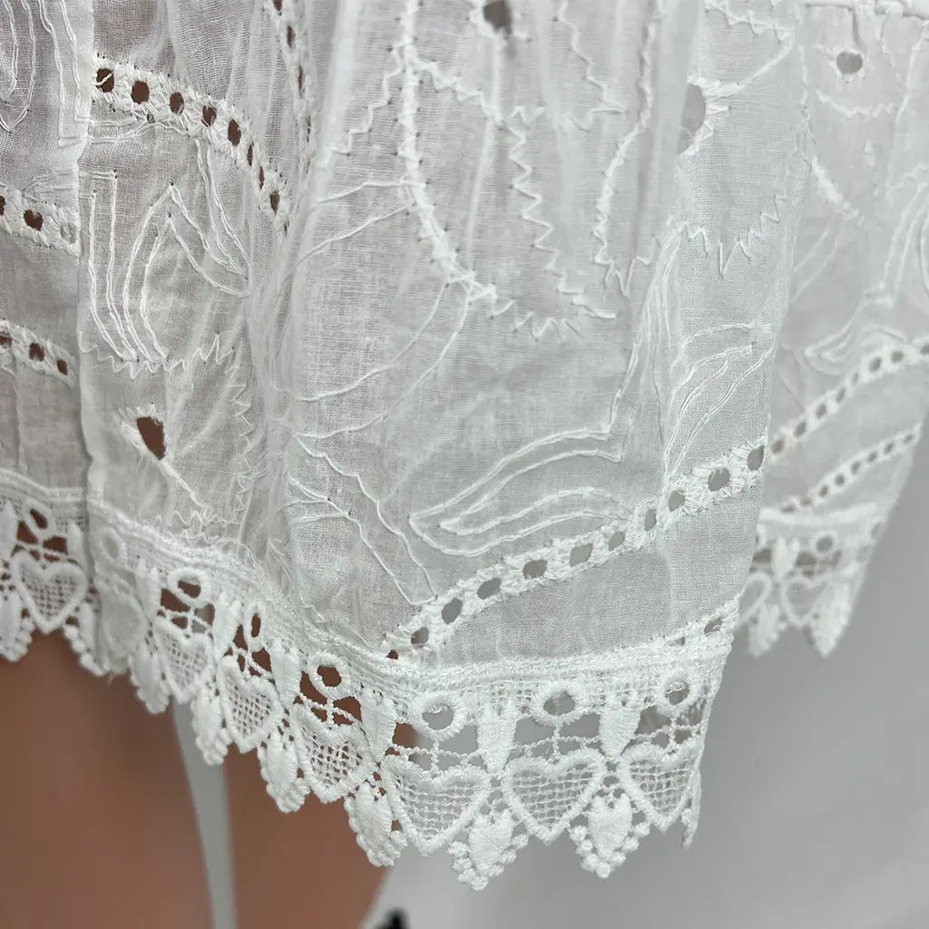 Front Hem View of a White Lace Summer Midi Dress