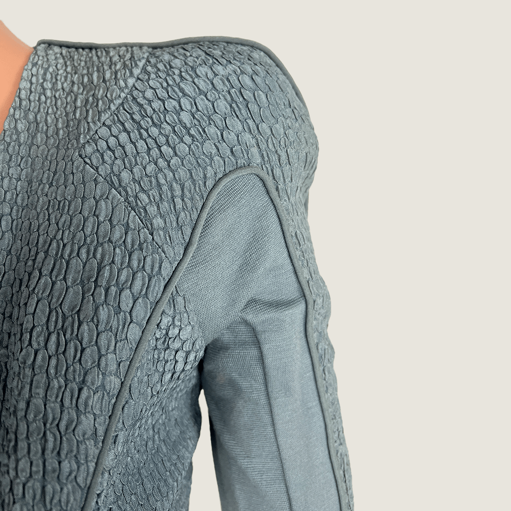 Front close up view of the shoulder on the Willow blue grey cut out evening dress