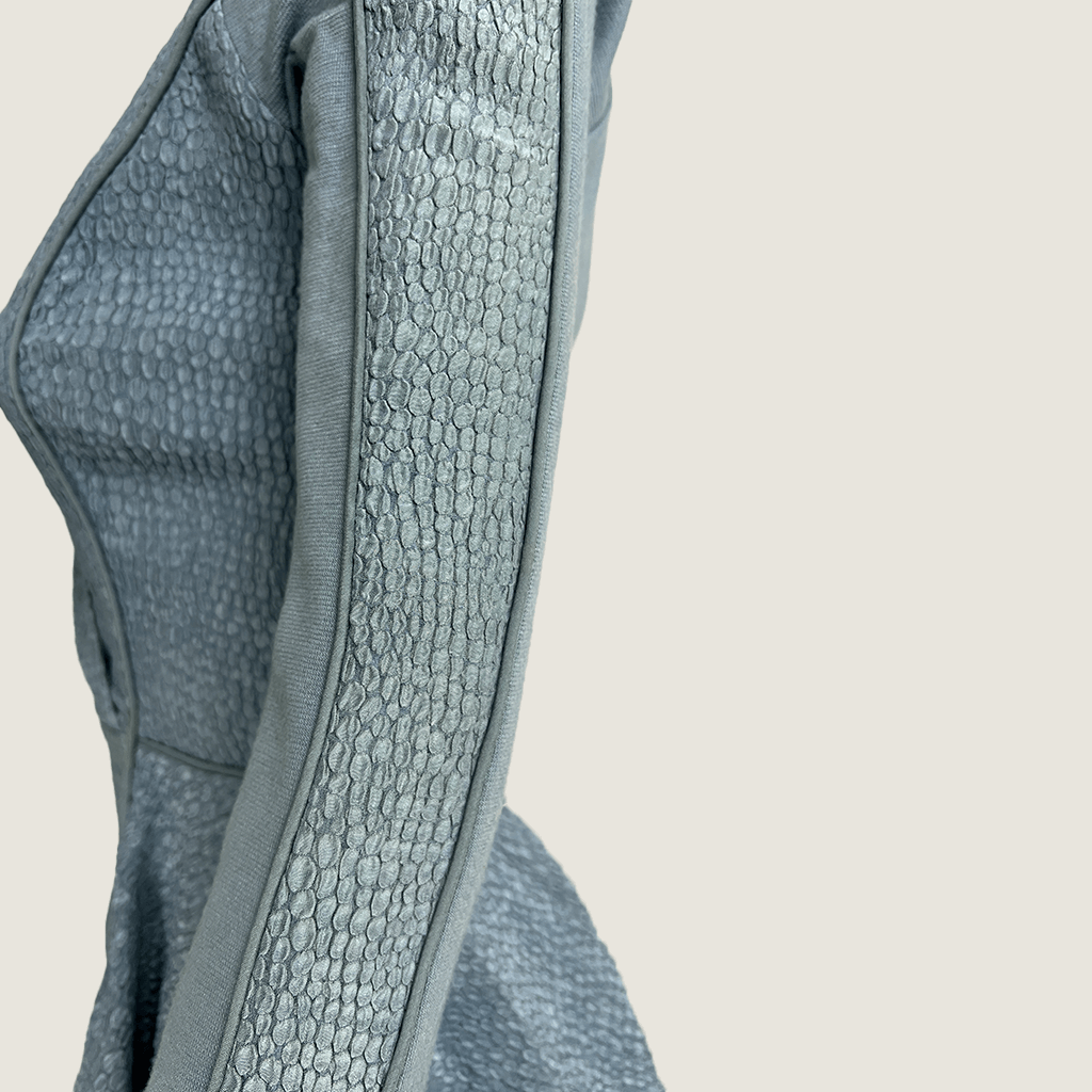 Side close up view of the sleeve on the Willow blue grey cut out evening dress