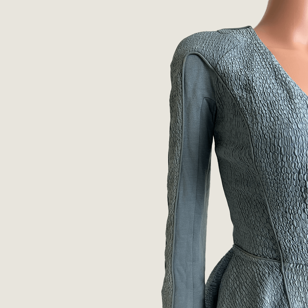 Front close up view of the exaggerated shoulder on the Willow blue grey cut out evening dress