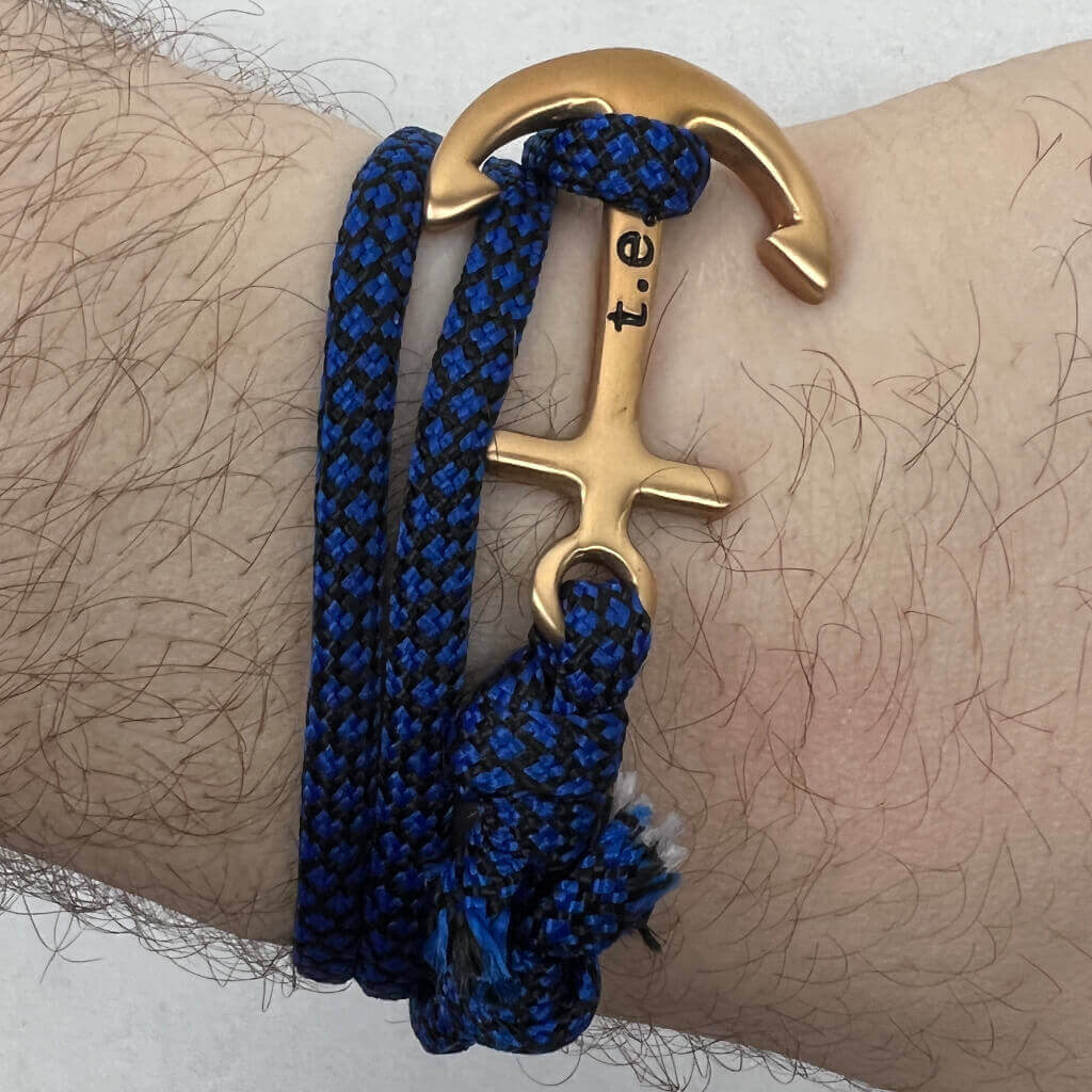 Men's blue and black rope bracelet with gold anchor
