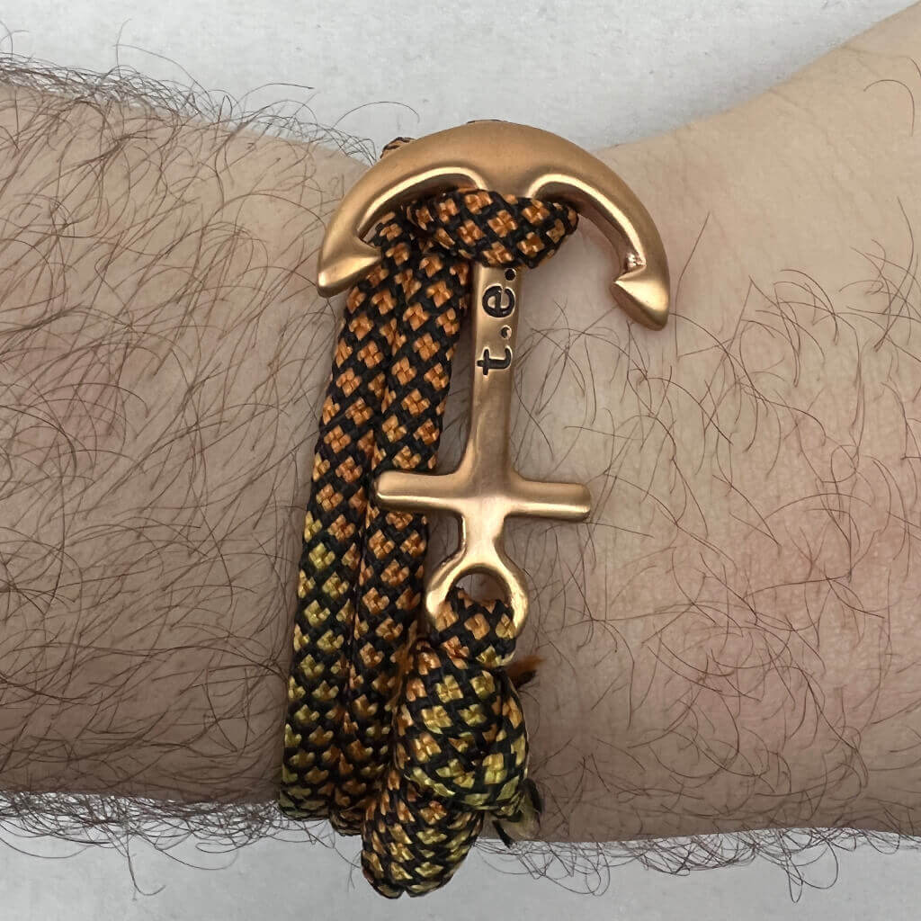 Men's orange, yellow and black rope bracelet with gold anchor