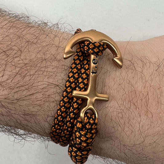 Men's orange and black rope bracelet with gold anchor