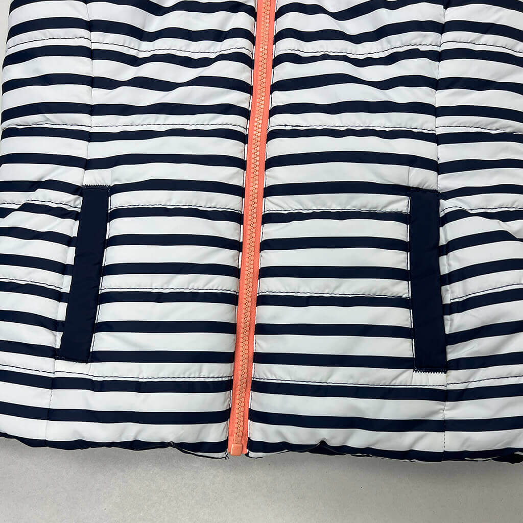 Girls reversable puffer vest blue and white detail