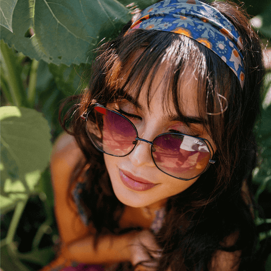 woman with sunglass amongst greenery