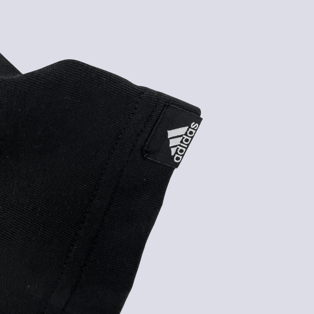 Sleeve detail view of the Adidas three stripes Tee