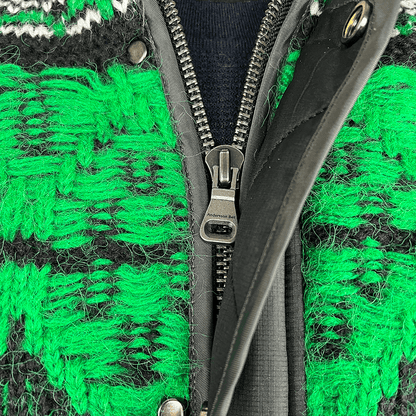 Front zip detail view of the Andersson Bell Unisex Nordic Knit Patch Quilted Parka