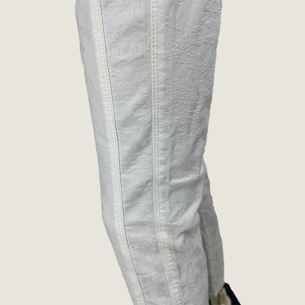 Side panel detail of the Apanage Ecru White Stretch Jeans