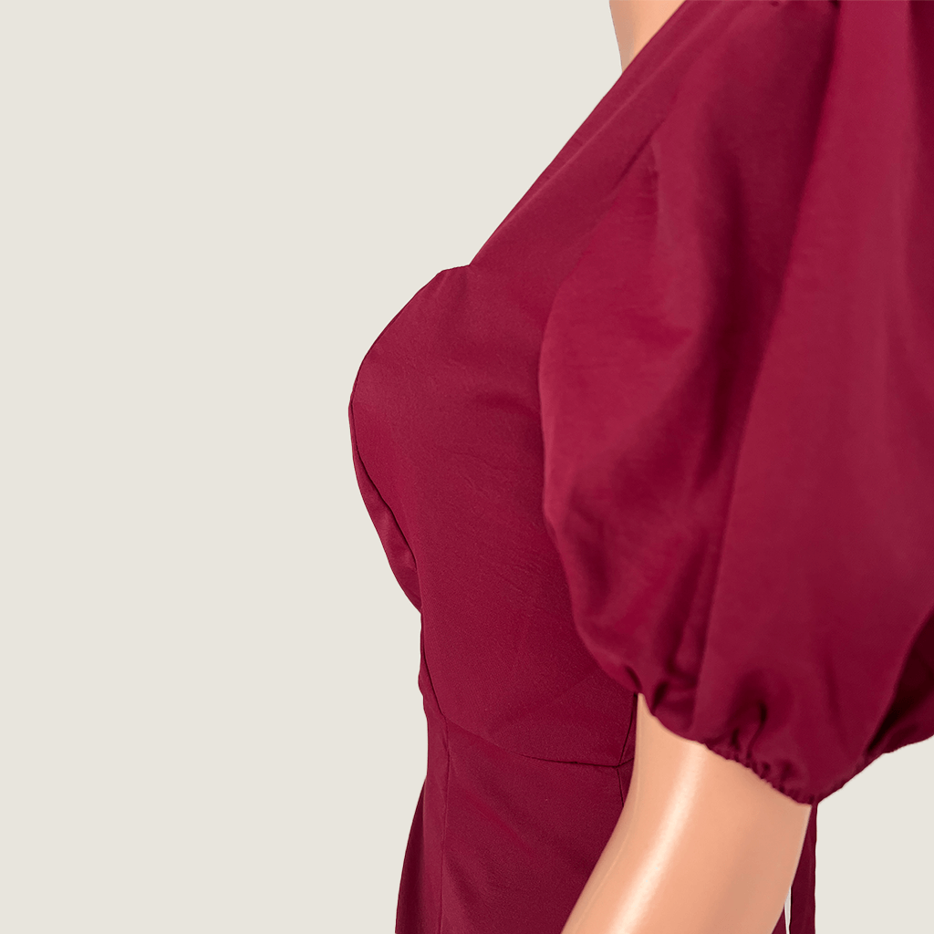 Side bust detail view of the Atmos&Here Burgundy Cap Sleeve Midi Dress