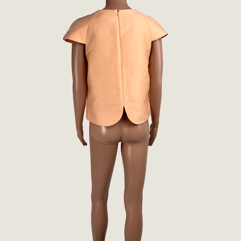 Back view a August Street short sleeve top in apricot