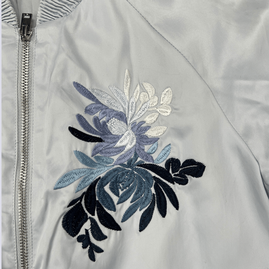 Front view of the baby blue satin bomber jacket
