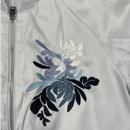 Front view of the baby blue satin bomber jacket