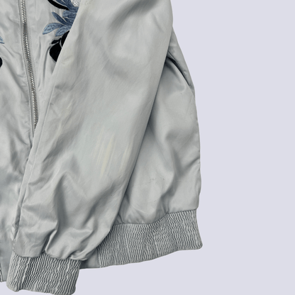 Front view of the baby blue satin bomber jacket