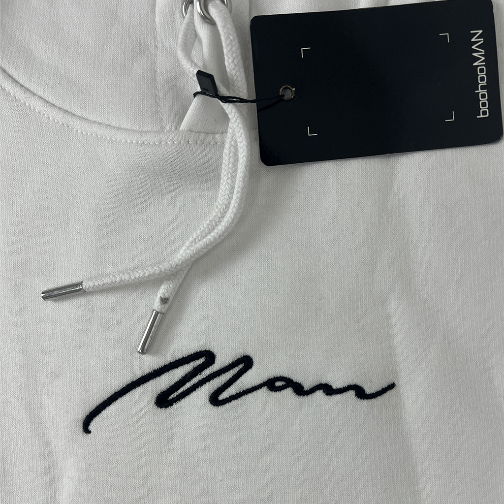 Front view of logo on the Boohoo Man white hoodie