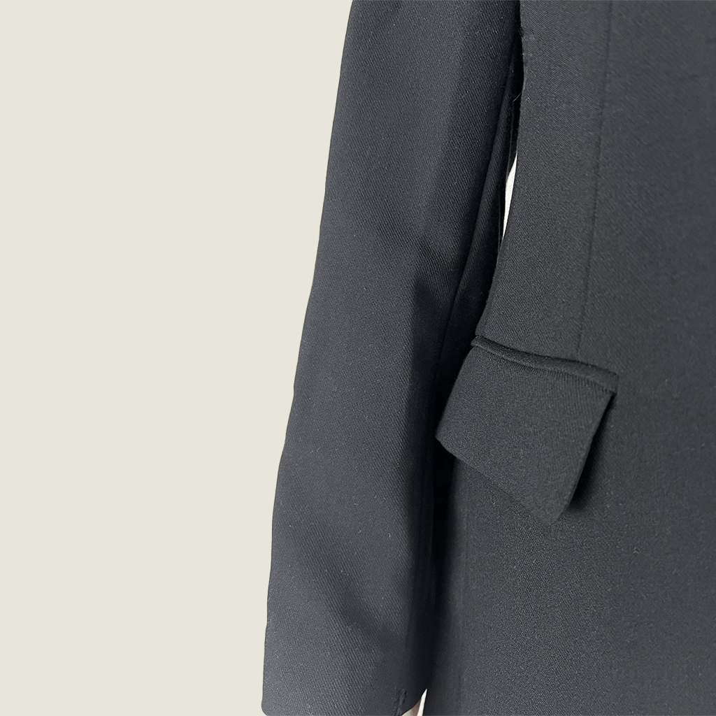 Side close up view of the Decjuba Black With White Jacket