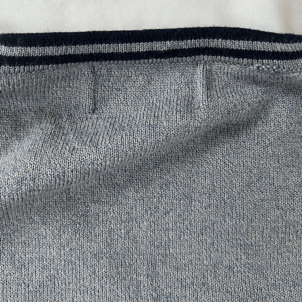 Hem detail view of the Fred Perry Knit Tennis V-Neck Jumper Hem Detail