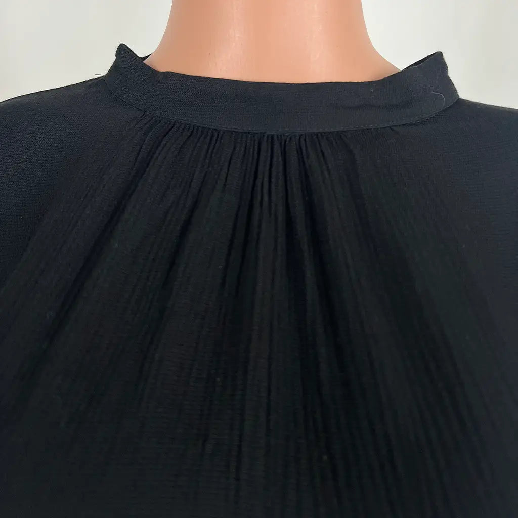 Front Collar Detail View of the G.D.S Short Sleeve Black Top