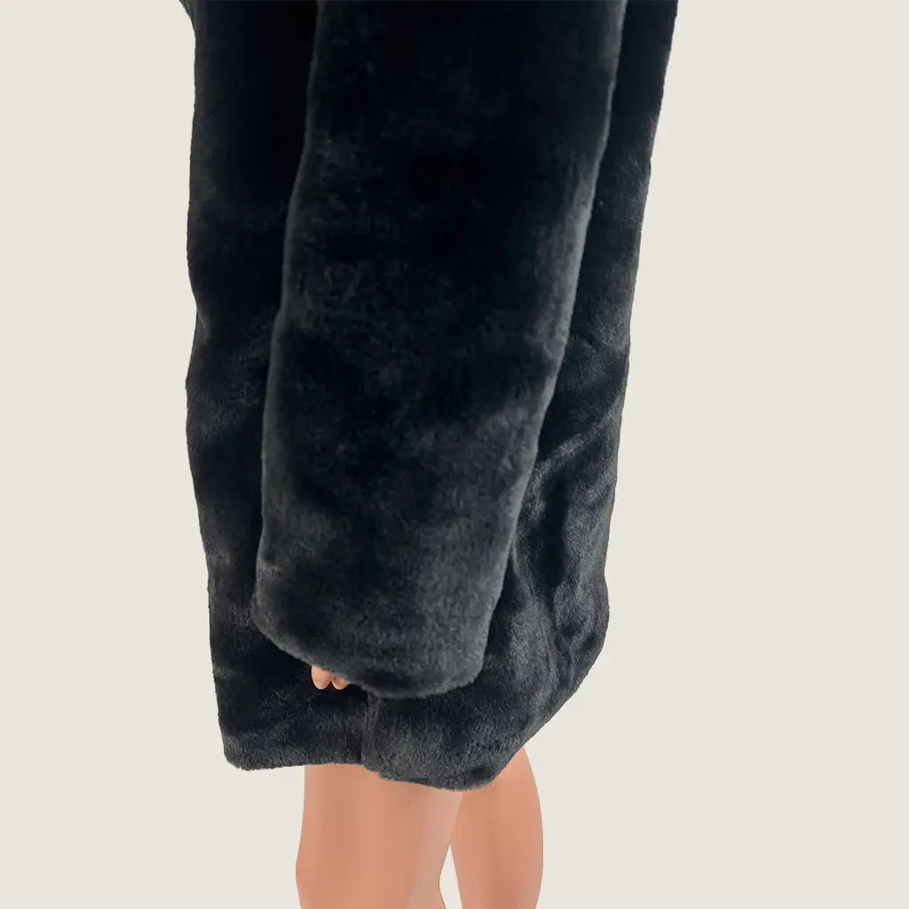 Side Hem View of the Indikah Black Faux Fur Women's Jacket