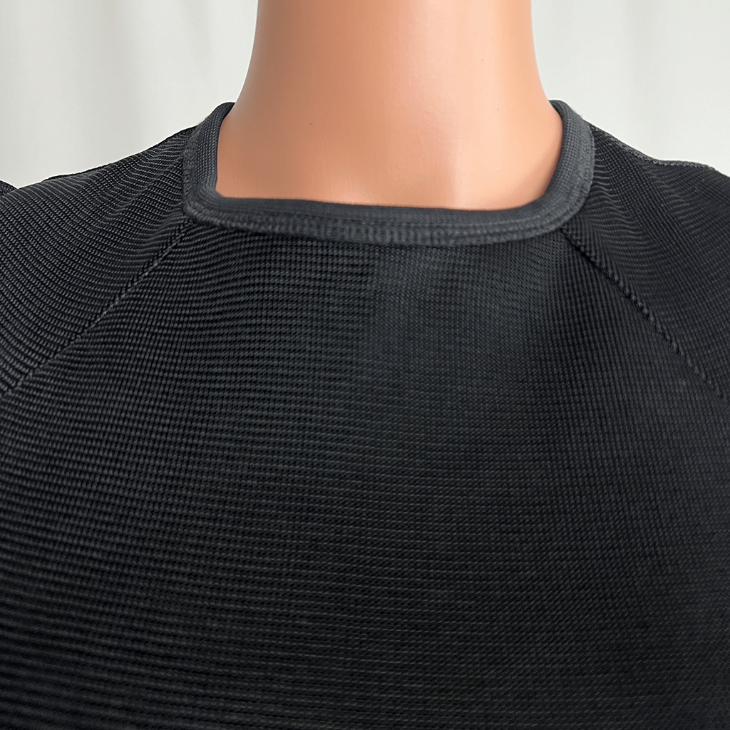 Front collar close up view of the Josh Goot black midi knit long sleeve dress