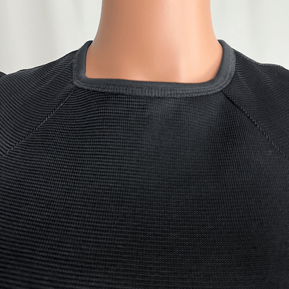 Front collar close up view of the Josh Goot black midi knit long sleeve dress