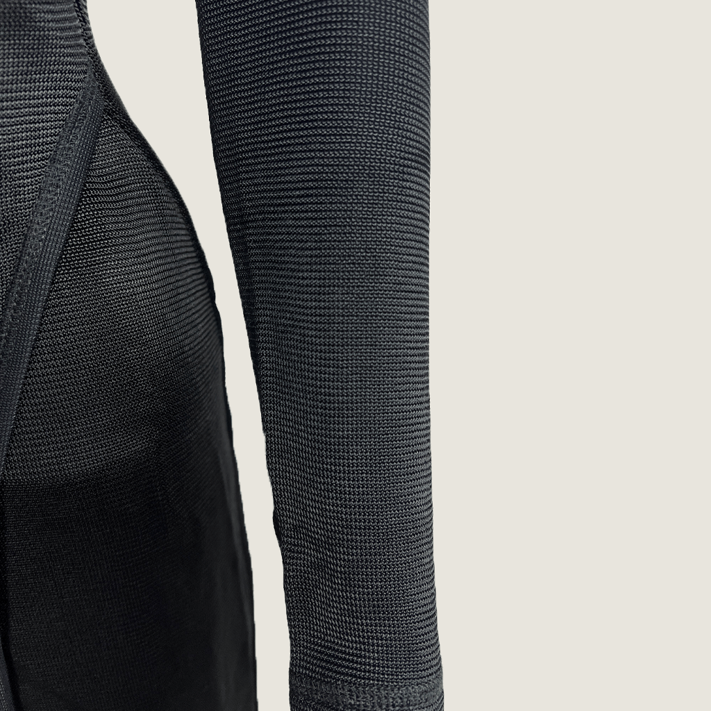 Sleeve detail view of the Josh Goot black midi knit long sleeve dress