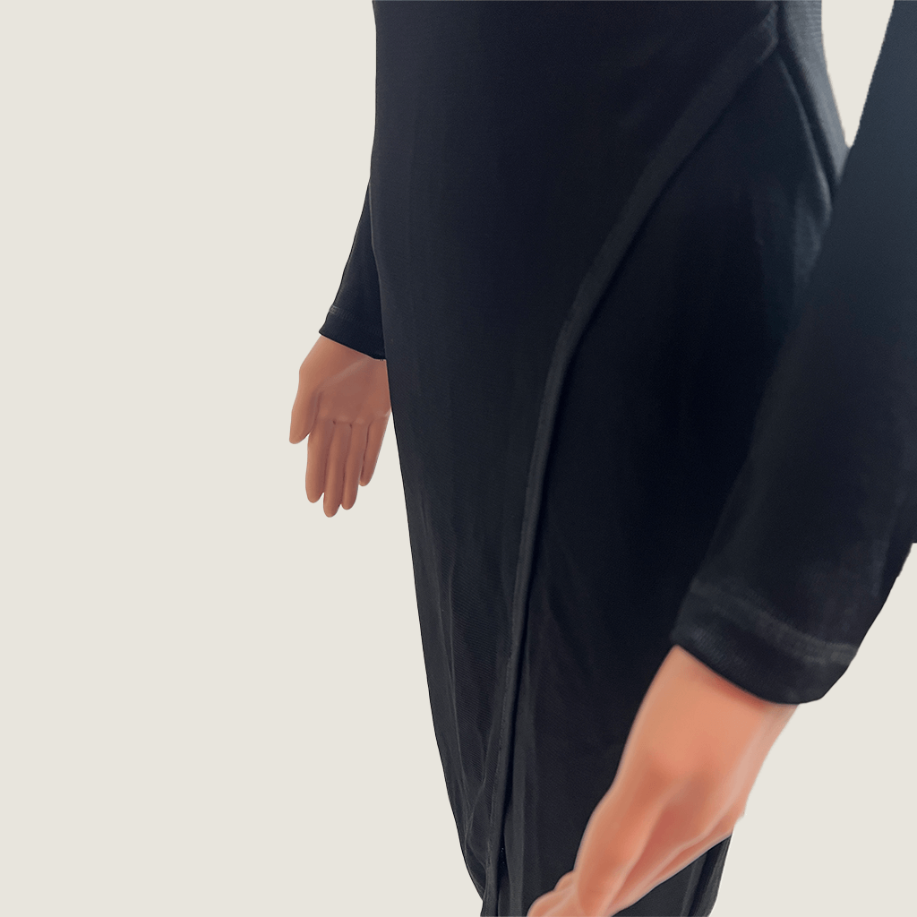 Front wrap skirt view of the Josh Goot black midi knit long sleeve dress