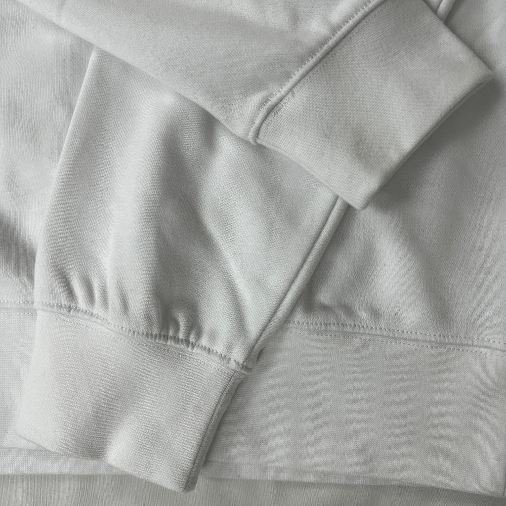 Cuff details of the Lacoste Men's White Logo Sweater