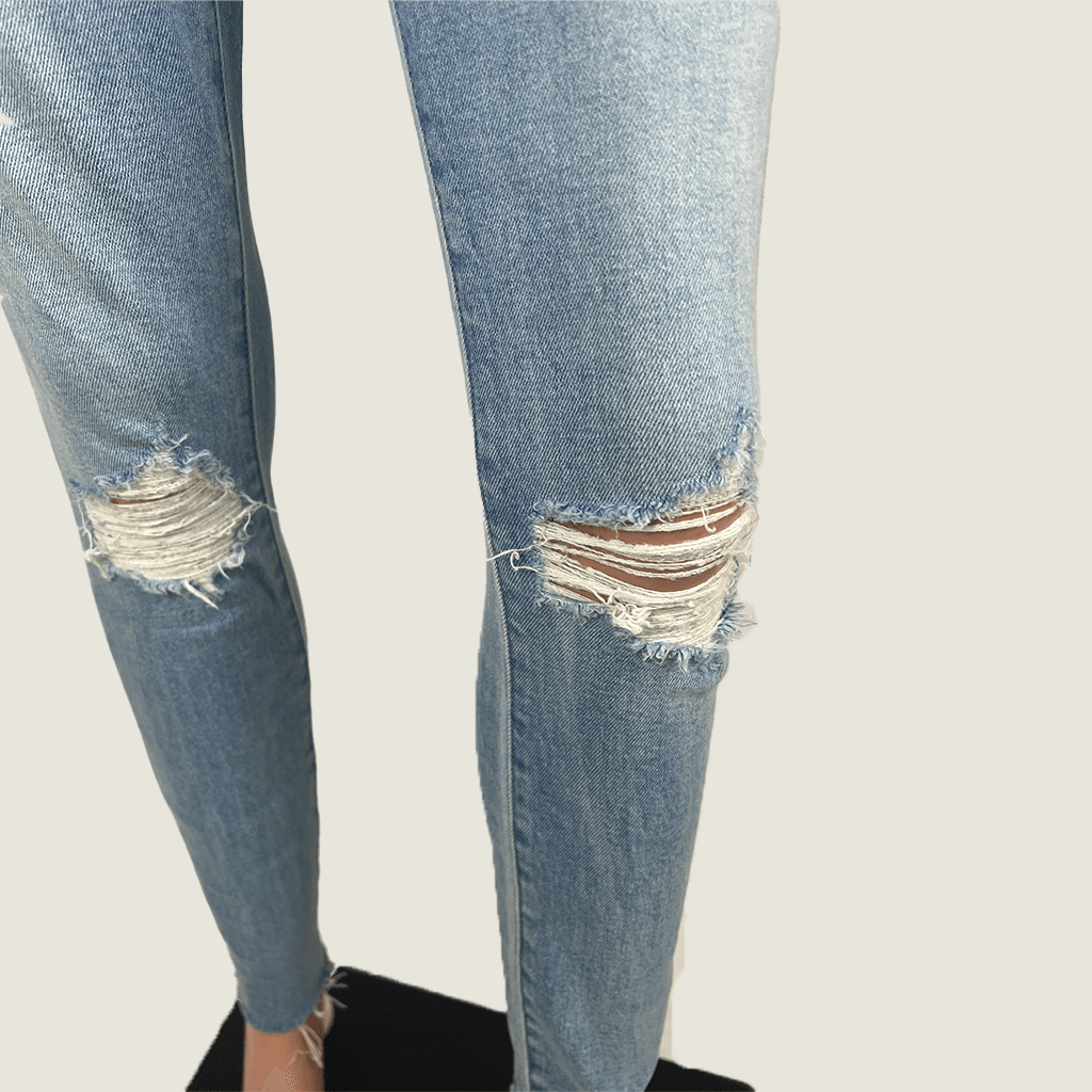 Side Close Up View of distressed knee's on the Lee High Licks Crop Denim Jeans