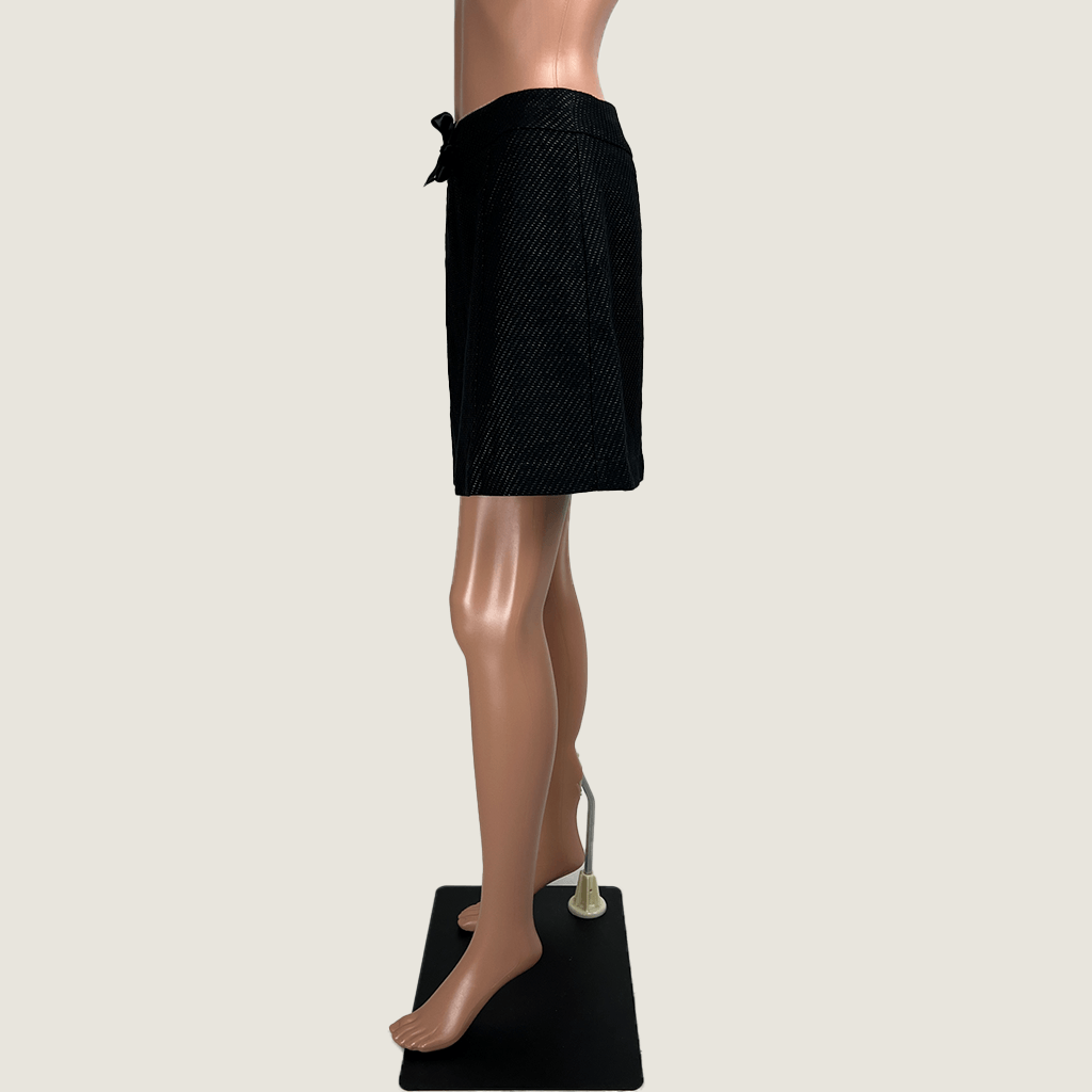 Side view of the Max & Co. black mini skirt