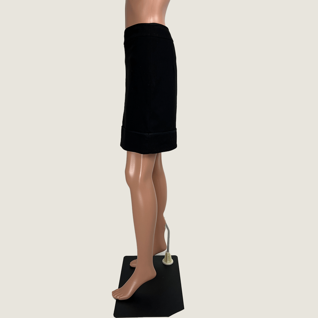 Side view of the Max & Co. black straight mini skirt