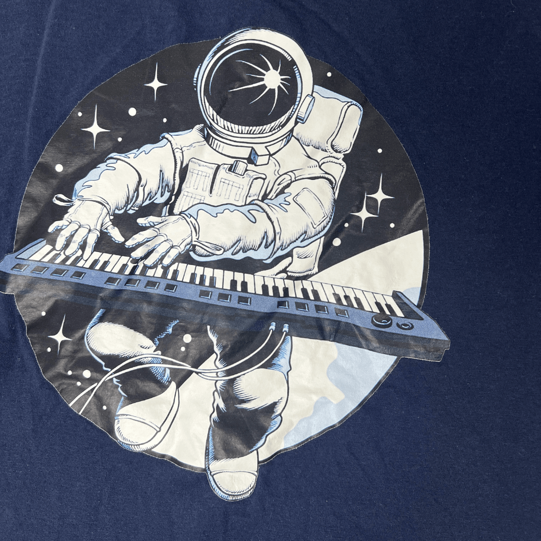 Front graphic detail view of a men's t-shirt with space graphic