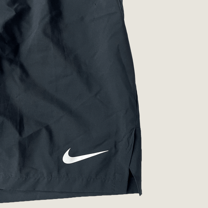 Front logo detail view of the Nike men's Dri-FIT short