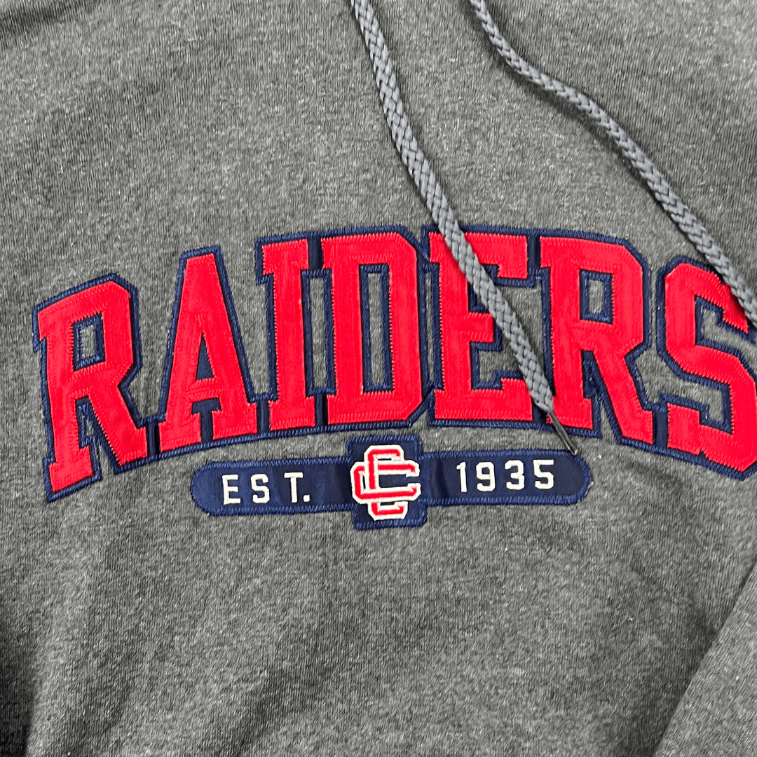 Front logo detail view of the Raiders hoodie