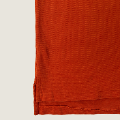 Front hem detail of the orange Ralph Lauren Short Sleeve Men's Polo 